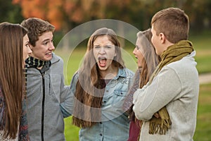 Startled Teens with Yelling Friend