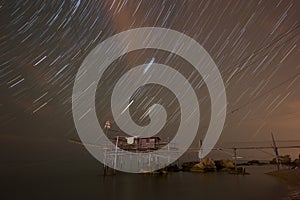 Startrail above the Trabocco of Punta Torre photo