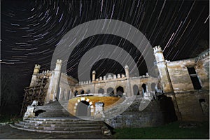 Startrails over the old abandoned house at night