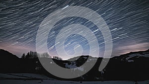 Startrails in winter starry night sky Astronomy Time lapse Comet Effect, Star trails in dark space background landscape