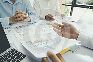 Startup asian business teamwork concept discussing graphs showing the results.