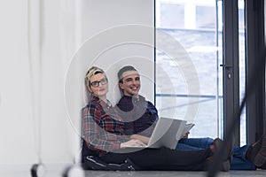 Startup business, couple working on laptop computer at office