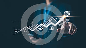 Startup business and investment concept. Businessman is touching the growing business graph. Planning and starting corporate