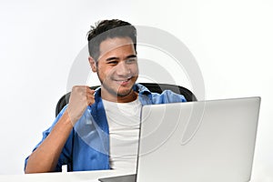 Startup business man raising his hand feeling happy for achieving work while using laptop