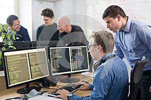 Startup business, software developer working on desktop computer.