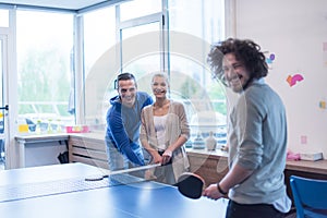 Startup business team playing ping pong tennis