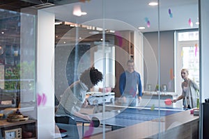 Startup business team playing ping pong tennis