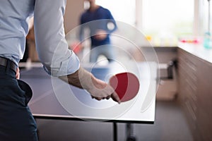 Startup business team playing ping pong tennis