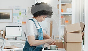 Startup, delivery and shipping in boxes for online shopping business. Businesswoman packing products from online