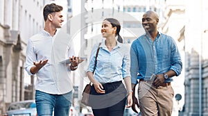 Startup entrepreneur, friends or corporate workers discuss project while walking in the city. Diversity, happy and