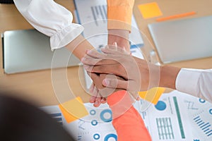 Startup man woman joining united hand, business team touching hands together. unity teamwork partnership concept