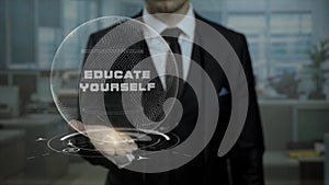 Startup management tutor presents concept Educate Yourself using hologram.