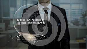 Startup management tutor presents concept New Mindset New Result using hologram.