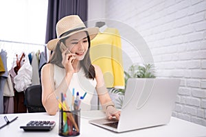 Startup small business entrepreneur SME, Asian woman smiling to answer customer questions