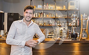 Startup successful small business entrepreneur owner man standing in his coffee shop or restaurant.