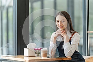 Startup successful small business owner sme beauty girl stand with tablet in coffee shop restaurant. Portrait of asian