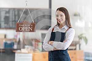 Startup successful small business owner sme beauty girl stand with tablet in coffee shop restaurant. Portrait of asian