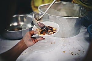 Starving homeless people receive food from volunteers who serve humane: the concept of giving with care