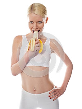 Starving woman eating banana