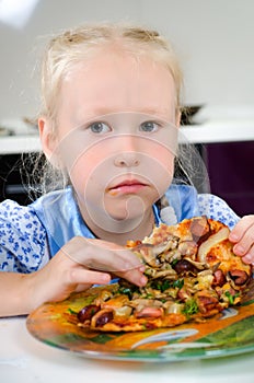 Starving young girl eating