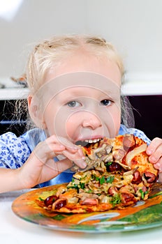 Starving young girl eating