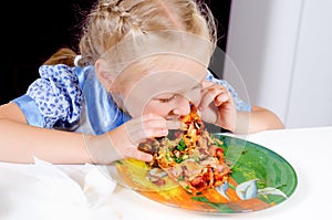 Starving young girl eating