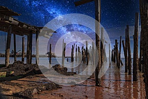 Stary sky milky way over a dilapidated old pier in Provincetown