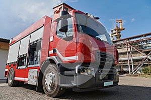 A state-of-the-art firetruck, equipped with advanced rescue technology, stands ready with its skilled firefighting team