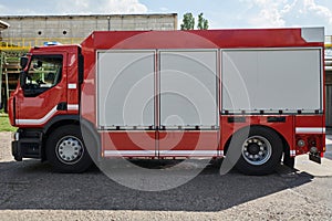 A state-of-the-art firetruck, equipped with advanced rescue technology, stands ready with its skilled firefighting team