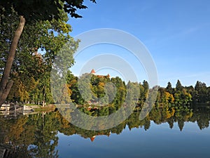 State castle Konopiste at pond in autumn