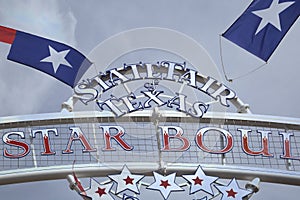State Fair Texas sign and flags