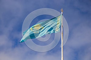 The state flag of the Republic of Kazakhstan fluttering in the wind.