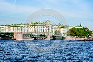 State Hermitage museum WInter palace and Palace bridge over Neva river, Saint Petersburg, Russia