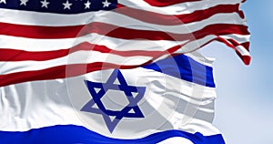State of Israel national flag waving in the wind with the American flag