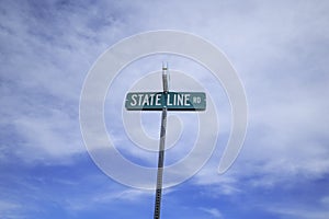 State Line Rd sign with sky background