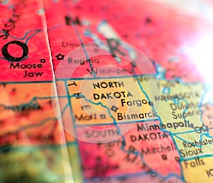 State of North Dakota map USA focus macro shot on globe for travel blogs, social media, web banners and backgrounds.