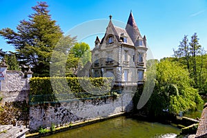 Stately home with a round tower in Moret-sur-Loing, France