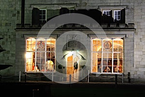 Stately home windows and door lit at night