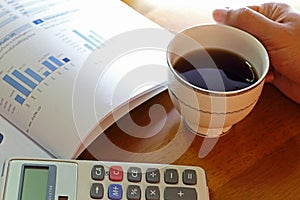 Statement with calculator and hand