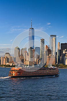 Staten Island ferry crossing locals and tourists to Manhattan before sunset. One of the best way to view the skyline of the city.