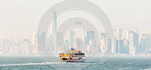 Staten Island Ferry and Lower Manhattan Skyline, New York, USA.