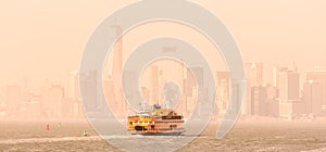 Staten Island Ferry and Lower Manhattan Skyline, New York, USA.