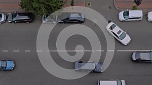 Static aerial top view: cars are driving on the road - city traffic