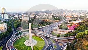 Static view automobiles in traffic on roundabout in Tbilisi center. Square of heroes monument