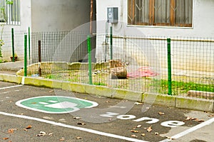 Static view personal parking spot for electric car outside in georgian neighborhood Saburtalo