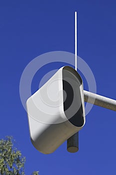 Static speed or safety camera against a blue sky