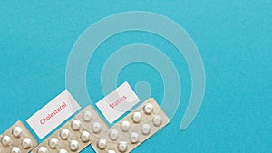 Statin tablets on a blue background