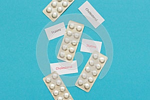 Statin tablets on a blue background