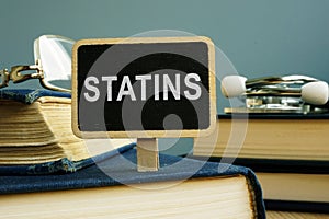 Statins concept. Pills and stethoscope photo
