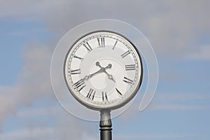station clock against the blue sky